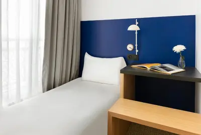 Un ou plusieurs lits dans un hébergement de l'établissement Oh la la ! Hotel Bar Paris Bastille