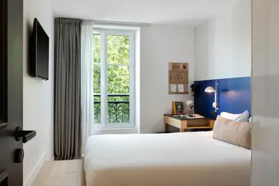 Un ou plusieurs lits dans un hébergement de l'établissement Oh la la ! Hotel Bar Paris Bastille