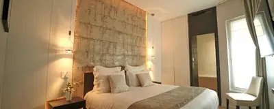 Un ou plusieurs lits dans un hébergement de l'établissement Hôtel Roi de Sicile - Rivoli