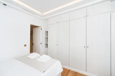Un ou plusieurs lits dans un hébergement de l'établissement Luxury Montaigne apartment