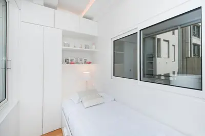 Un ou plusieurs lits dans un hébergement de l'établissement Luxury Montaigne apartment