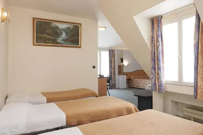 Un ou plusieurs lits dans un hébergement de l'établissement Hotel Ferney République