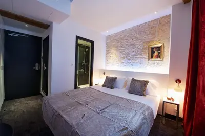 Un ou plusieurs lits dans un hébergement de l'établissement Hôtel le Clos de Notre Dame