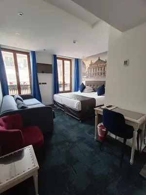 Un ou plusieurs lits dans un hébergement de l'établissement Hotel Aida Marais