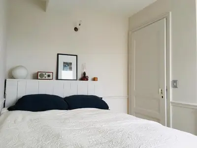 Un ou plusieurs lits dans un hébergement de l'établissement Elegant and cosy flat near Montmartre