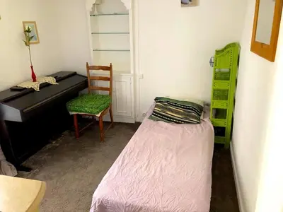 Un ou plusieurs lits dans un hébergement de l'établissement L'appartement Boulnois