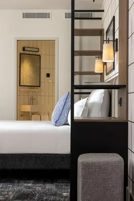 Un ou plusieurs lits dans un hébergement de l'établissement Hôtel Moderniste