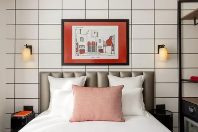 Un ou plusieurs lits dans un hébergement de l'établissement Hôtel Moderniste