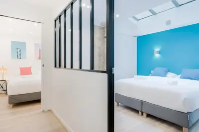 Un ou plusieurs lits dans un hébergement de l'établissement Loft Design - 8 guests - Heart of Paris