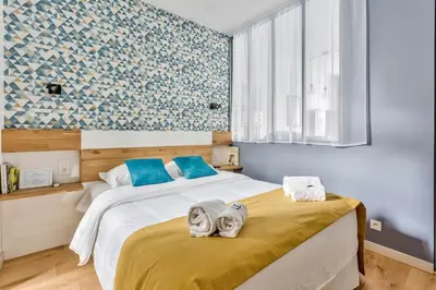 Un ou plusieurs lits dans un hébergement de l'établissement Amazing 2 Rooms Flat near Bastille - An Ecoloflat