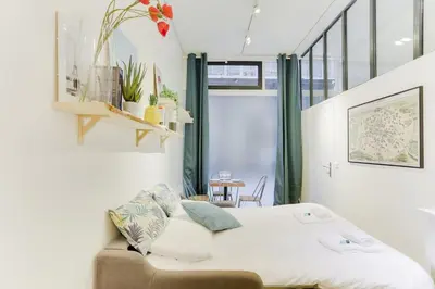 Un ou plusieurs lits dans un hébergement de l'établissement Design Apartment - 4 guests - Louvre & Opera