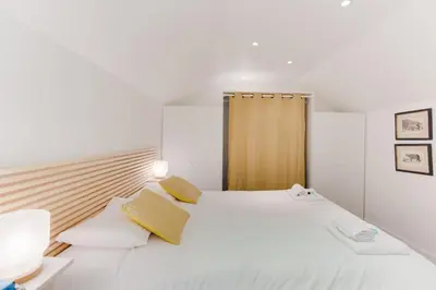 Un ou plusieurs lits dans un hébergement de l'établissement Design Apartment - 4 guests - Louvre & Opera
