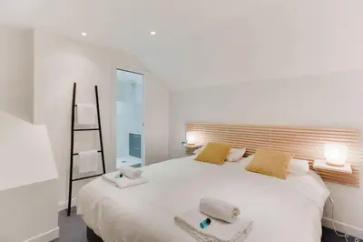 Un ou plusieurs lits dans un hébergement de l'établissement Design Apartment - 4 guests - Louvre & Opera