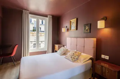 Un ou plusieurs lits dans un hébergement de l'établissement Hôtel Maât Etoile