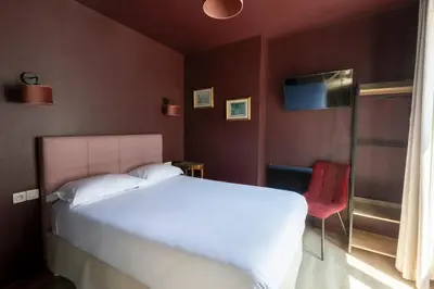 Un ou plusieurs lits dans un hébergement de l'établissement Hôtel Maât Etoile
