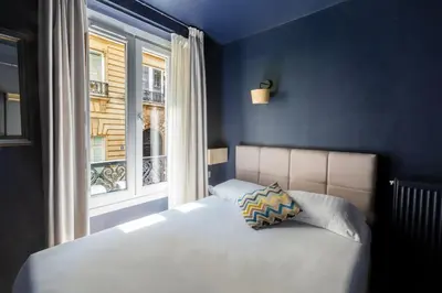 Un ou plusieurs lits dans un hébergement de l'établissement Hôtel Maât Etoile