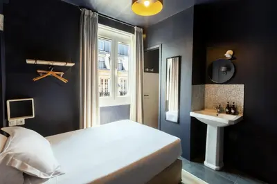Un ou plusieurs lits dans un hébergement de l'établissement Hôtel Maât Etoile