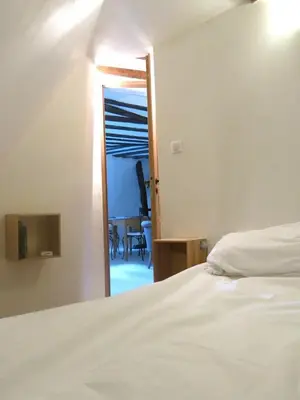 Un ou plusieurs lits dans un hébergement de l'établissement Apartment Saintonge CityCosy
