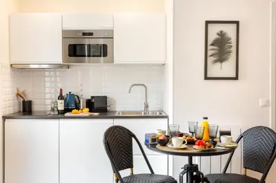 Cuisine ou kitchenette dans l'établissement Résidence Saint-Sabin