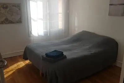 Un ou plusieurs lits dans un hébergement de l'établissement Malakoff Grand apartment