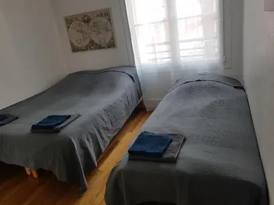 Un ou plusieurs lits dans un hébergement de l'établissement Malakoff Grand apartment