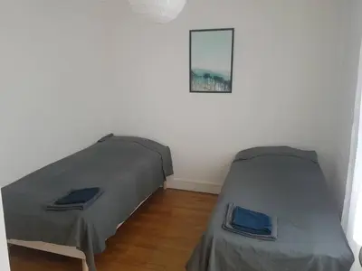Un ou plusieurs lits dans un hébergement de l'établissement Malakoff Grand apartment