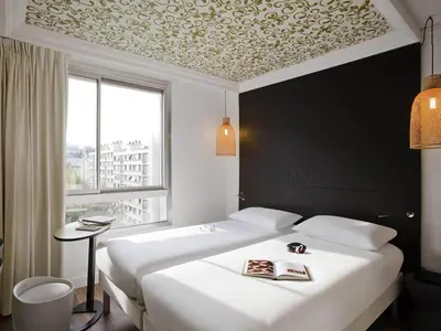 Un ou plusieurs lits dans un hébergement de l'établissement ibis Styles Paris Buttes Chaumont