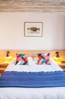 Un ou plusieurs lits dans un hébergement de l'établissement Hôtel Montholon