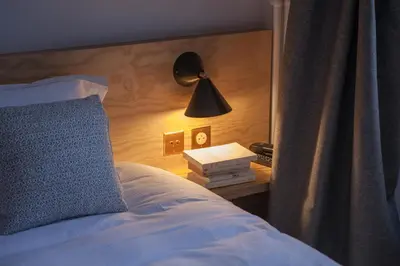 Un ou plusieurs lits dans un hébergement de l'établissement Hôtel Montholon