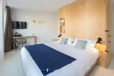 Un ou plusieurs lits dans un hébergement de l'établissement Hôtel Montholon