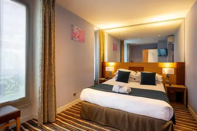Un ou plusieurs lits dans un hébergement de l'établissement Hôtel Pavillon Bastille