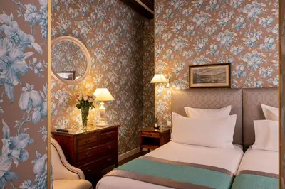 Un ou plusieurs lits dans un hébergement de l'établissement Relais Hôtel du Vieux Paris