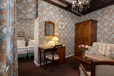 Un ou plusieurs lits dans un hébergement de l'établissement Relais Hôtel du Vieux Paris