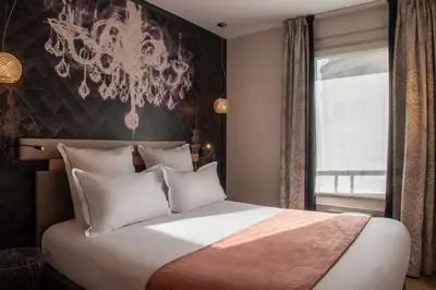 Un ou plusieurs lits dans un hébergement de l'établissement Hotel Yllen Eiffel