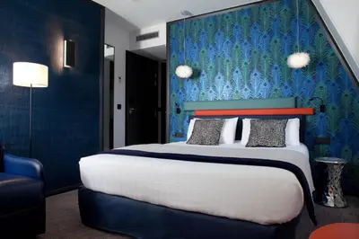 Un ou plusieurs lits dans un hébergement de l'établissement Hotel Yllen Eiffel