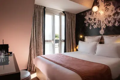 Un ou plusieurs lits dans un hébergement de l'établissement Hotel Yllen Eiffel