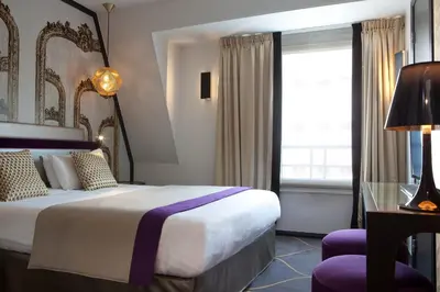 Un ou plusieurs lits dans un hébergement de l'établissement Hotel Yllen Eiffel
