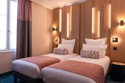 Un ou plusieurs lits dans un hébergement de l'établissement Leonardo Boutique Hotel Paris Opera