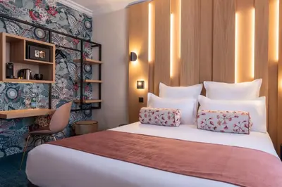 Un ou plusieurs lits dans un hébergement de l'établissement Leonardo Boutique Hotel Paris Opera