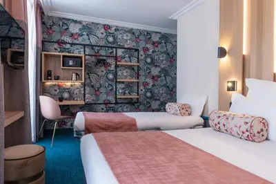 Un ou plusieurs lits dans un hébergement de l'établissement Leonardo Boutique Hotel Paris Opera