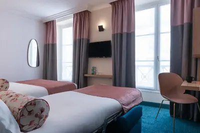 Un ou plusieurs lits dans un hébergement de l'établissement Leonardo Boutique Hotel Paris Opera