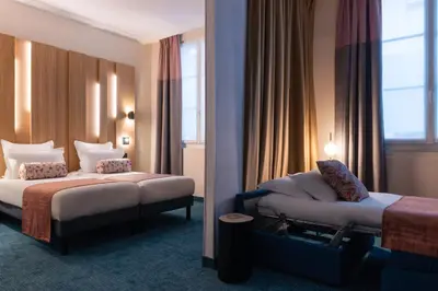 Un ou plusieurs lits dans un hébergement de l'établissement Leonardo Boutique Hotel Paris Opera