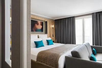 Un ou plusieurs lits dans un hébergement de l'établissement Hotel Louvre Saint-Honoré