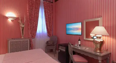Un ou plusieurs lits dans un hébergement de l'établissement Hôtel Beaubourg