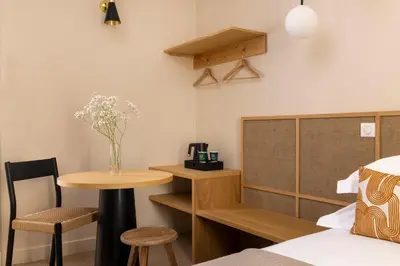 Un ou plusieurs lits dans un hébergement de l'établissement Hôtel Joe M