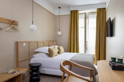 Un ou plusieurs lits dans un hébergement de l'établissement Hôtel Joe M