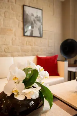 Un ou plusieurs lits dans un hébergement de l'établissement Hotel Elysees Opera