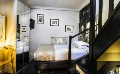 Un ou plusieurs lits dans un hébergement de l'établissement Hotel Ile de France Opéra