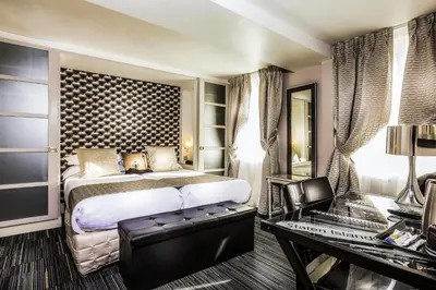 Un ou plusieurs lits dans un hébergement de l'établissement Hotel Ile de France Opéra