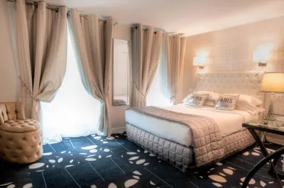 Un ou plusieurs lits dans un hébergement de l'établissement Hotel Ile de France Opéra